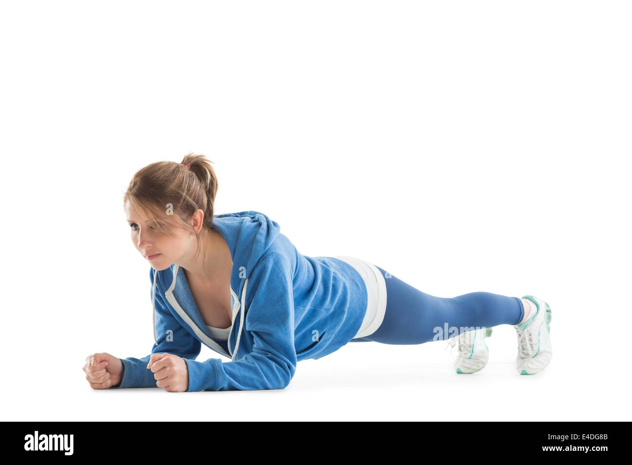 Young woman in basic plank posture Stock Photo
