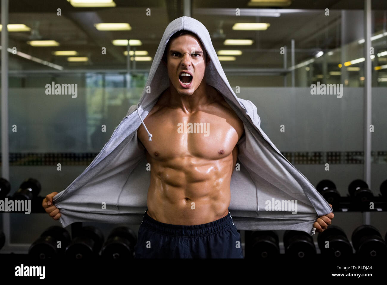 Muscular man shouting in health club Stock Photo