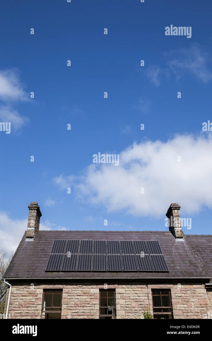 Rooftop solar panels under a blue sky Stock Photo - Alamy