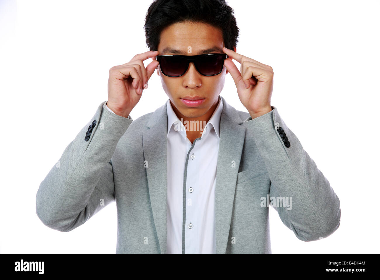 Portrait of a serious fashion asian man over white background Stock Photo