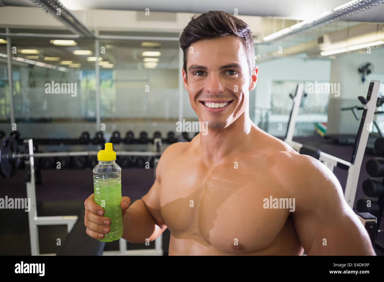 Sporty young man with energy drink in gym Stock Photo Alamy