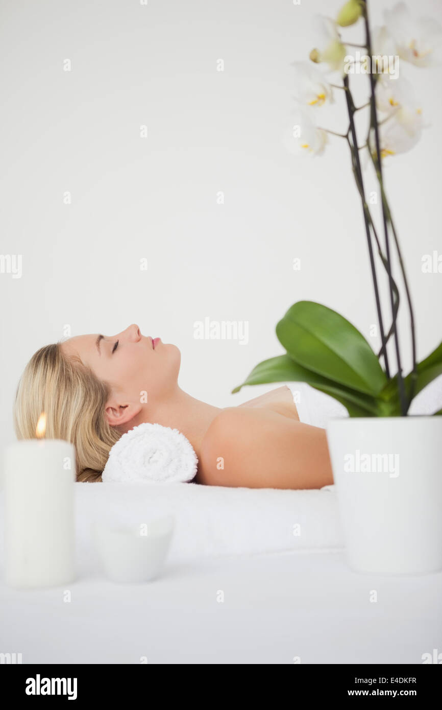 Beautiful blonde lying on massage table Stock Photo - Alamy