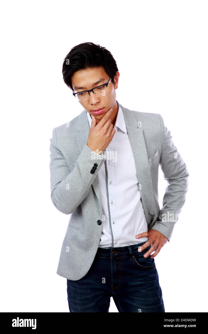 Portrait of a pensive asian man isolated on a white background Stock Photo