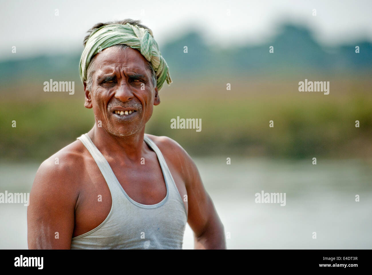 Local man from Chitwan Nepal bathing in river Stock Photo