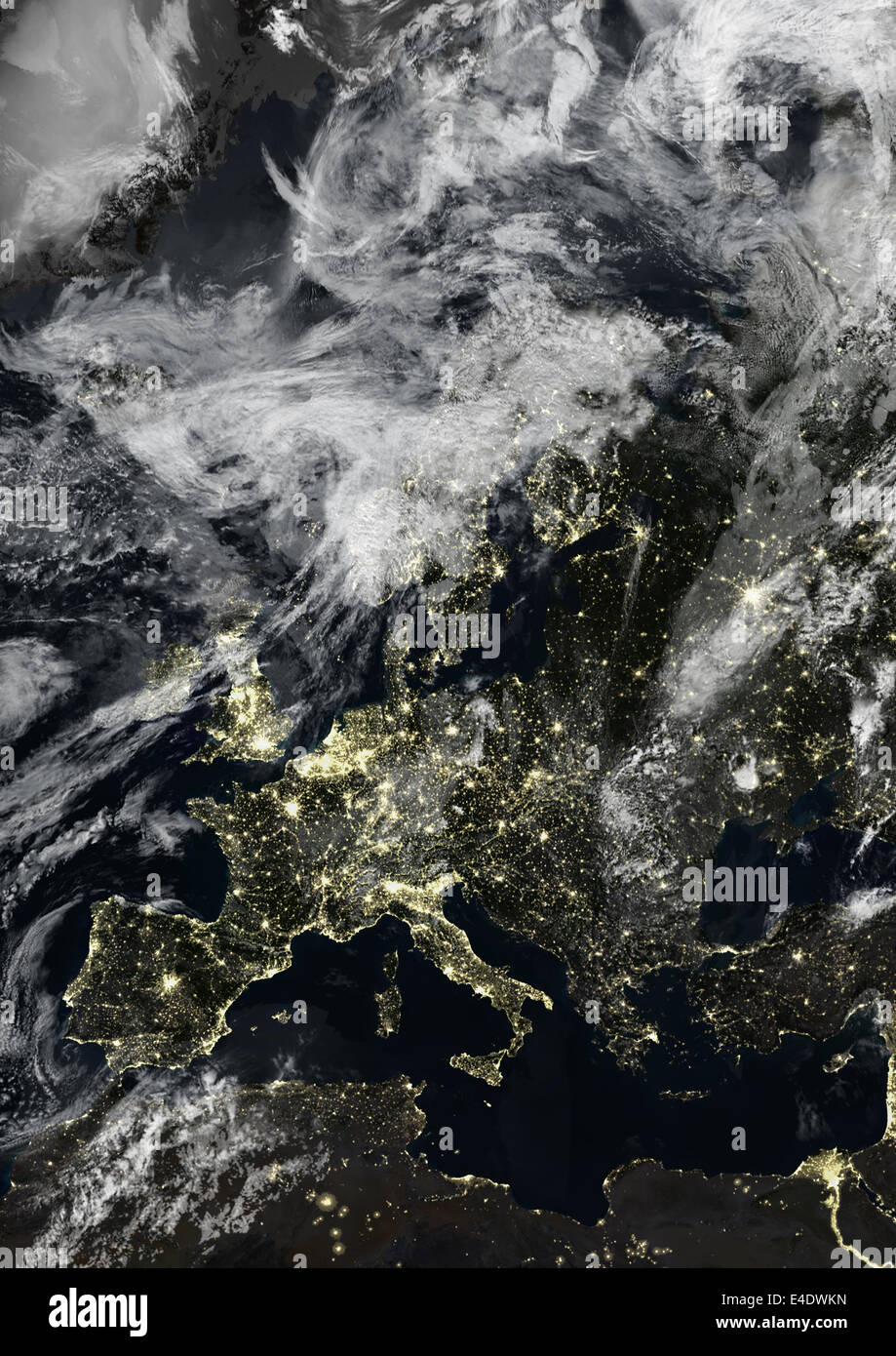 Europe At Night With Cloud Coverage, True Colour Satellite Image. True colour satellite image of Europe at night with cloud cove Stock Photo