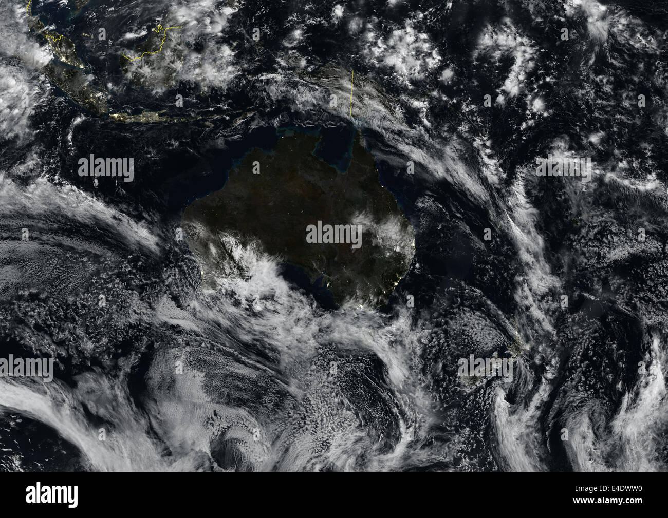 Oceania At Night With Country Borders And Cloud Coverage, True Colour Satellite Image. True colour satellite image of Oceania at Stock Photo