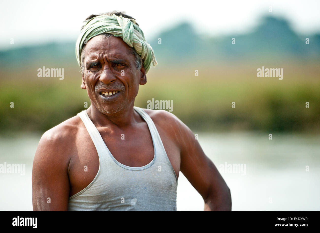 Local man bathing in the river near Chitwan National Park Stock Photo