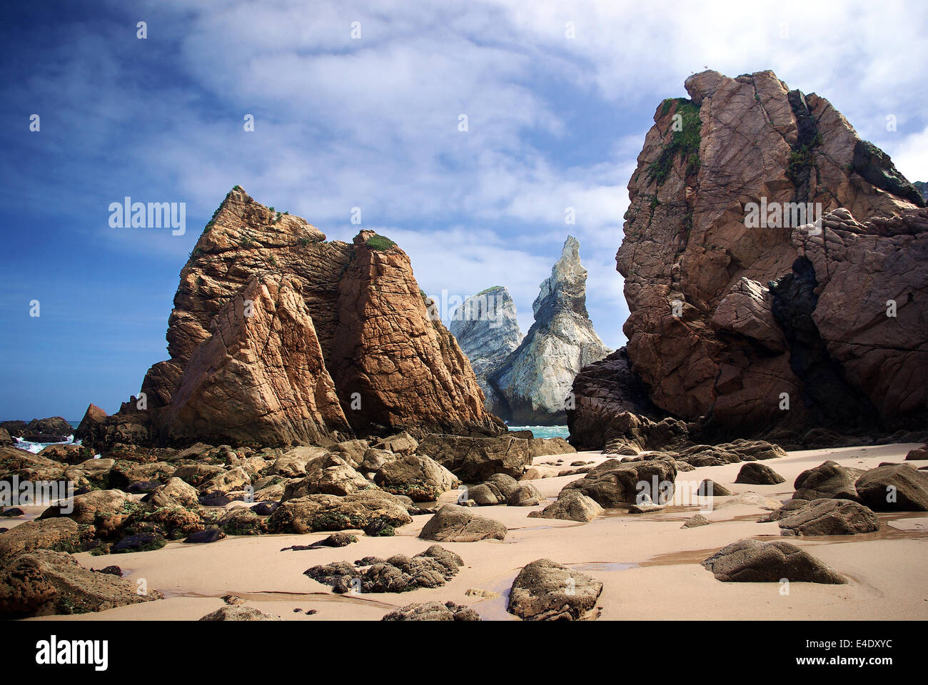 Big and sharp rocky cliffs in Ursa beach, Portugal, in a sunny morning Stock Photo