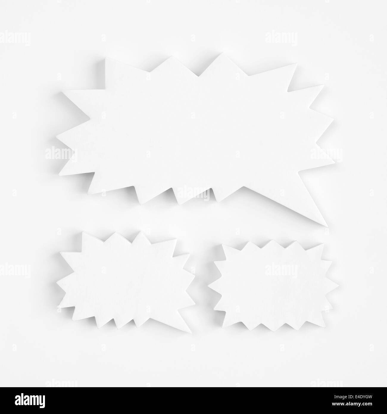 Blank white paper speech bubbles of cartoon and comics over paper ...