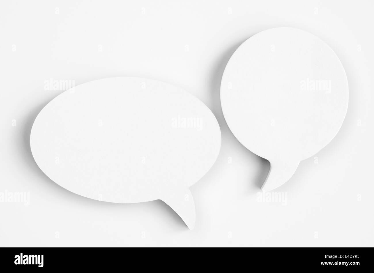 Blank white paper speech bubbles of cartoon and comics over paper background Stock Photo