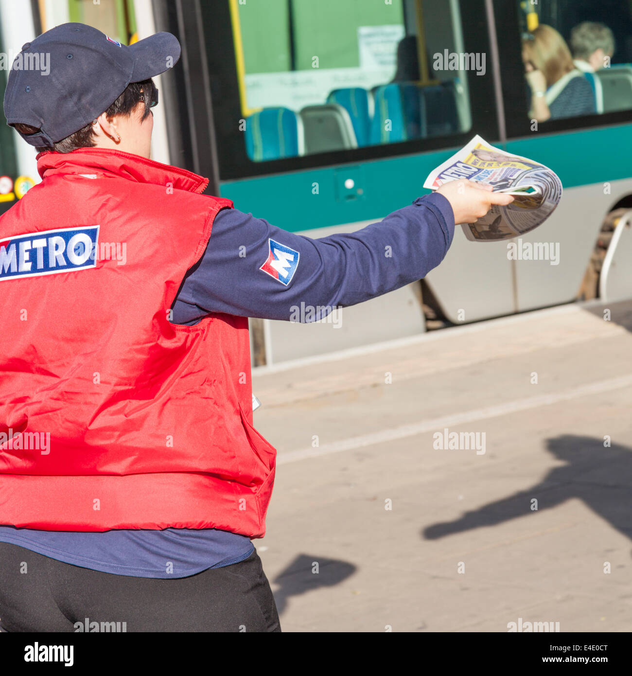 Metro newspaper distributor giving out free newspapers, Nottingham, England, UK Stock Photo