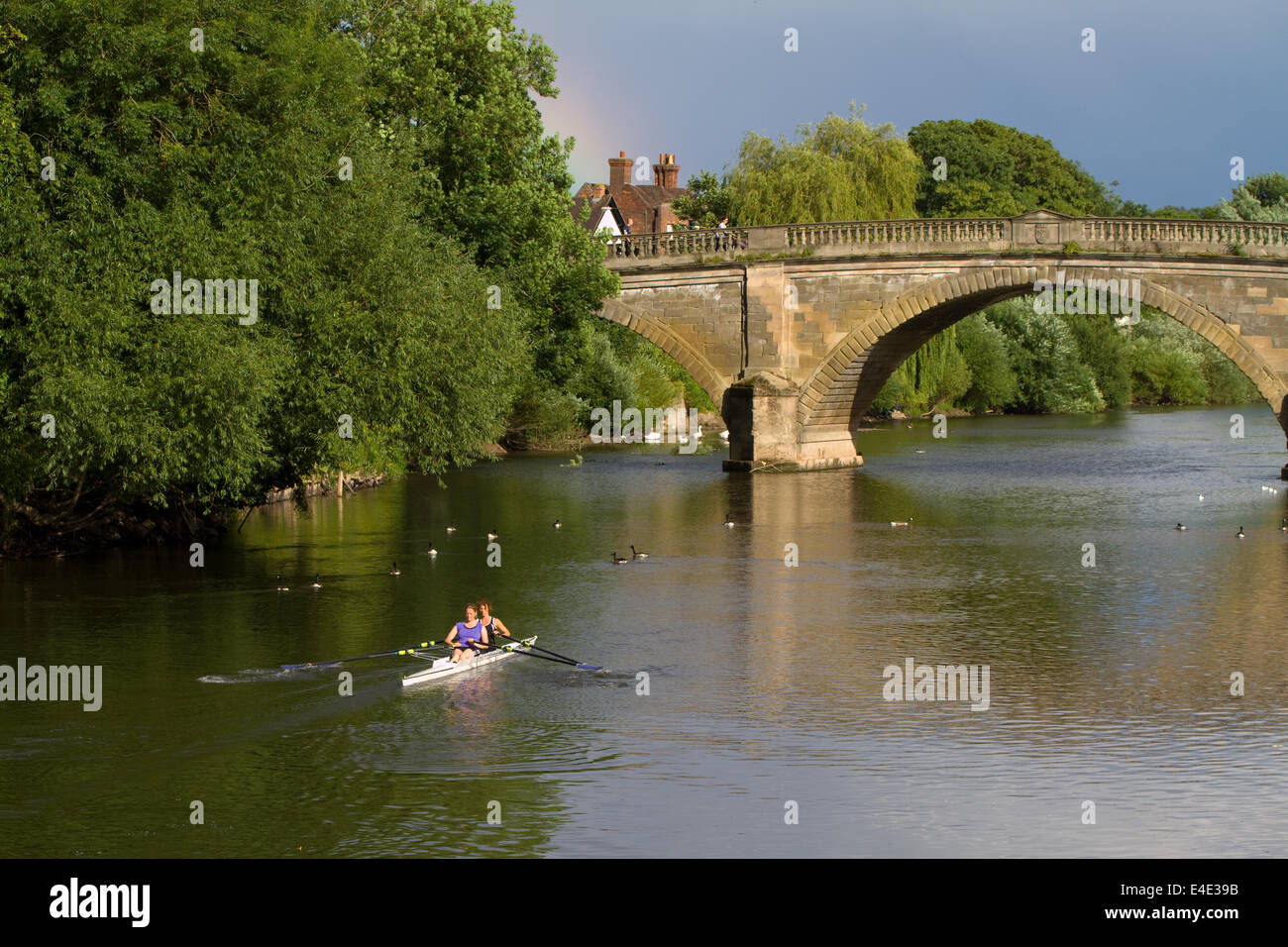 two women rowers rowing on the River Severn near the bridge at Bewdley