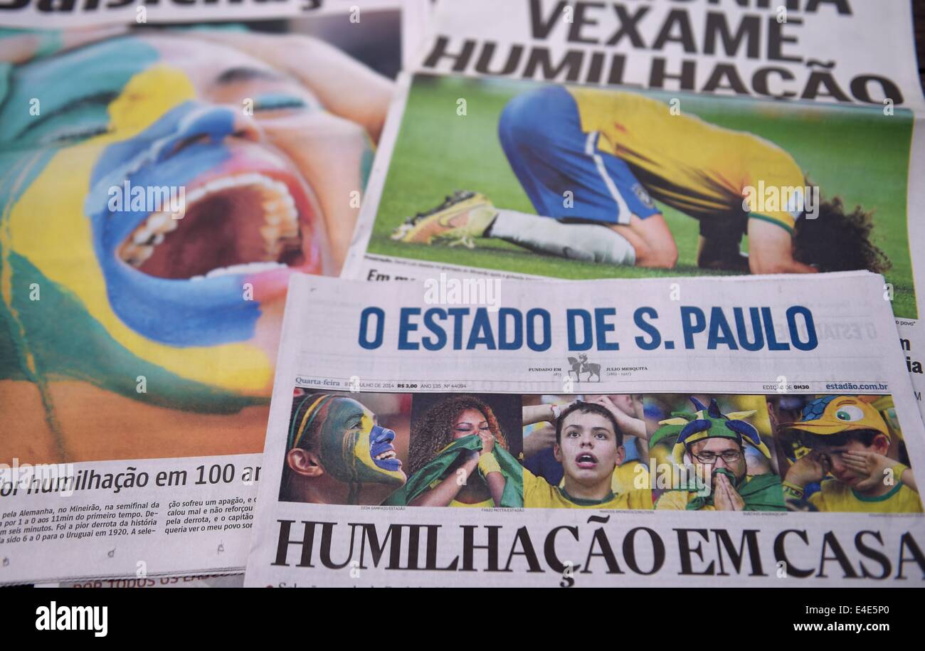 Sao Paulo, Brazil. 09 July, 2014. Brazilian newspapers 'Agora', 'O Globo' and 'O Estado de S. Paulo' lie on a table in Sao Paulo, Brazil, 09 July 2014 featuring photos of the World Cup semi-final match Brazil-Germany. Photo: Marius Becker/dpa/Alamy Live News Stock Photo