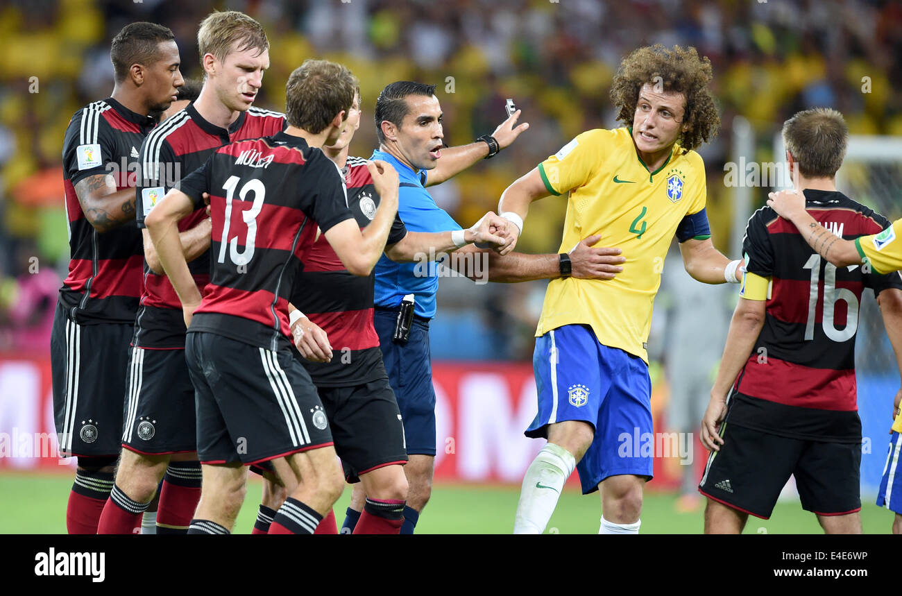 Belo Horizonte, Brazil. 08th July, 2014. Referee Marco Rodriguez of Mexico (C) argues with Brazil's David Luiz and German players during the FIFA World Cup 2014 semi-final soccer match between Brazil and Germany at Estadio Mineirao in Belo Horizonte, Brazil, 08 July 2014. Photo: Marcus Brandt/dpa/Alamy Live News Stock Photo