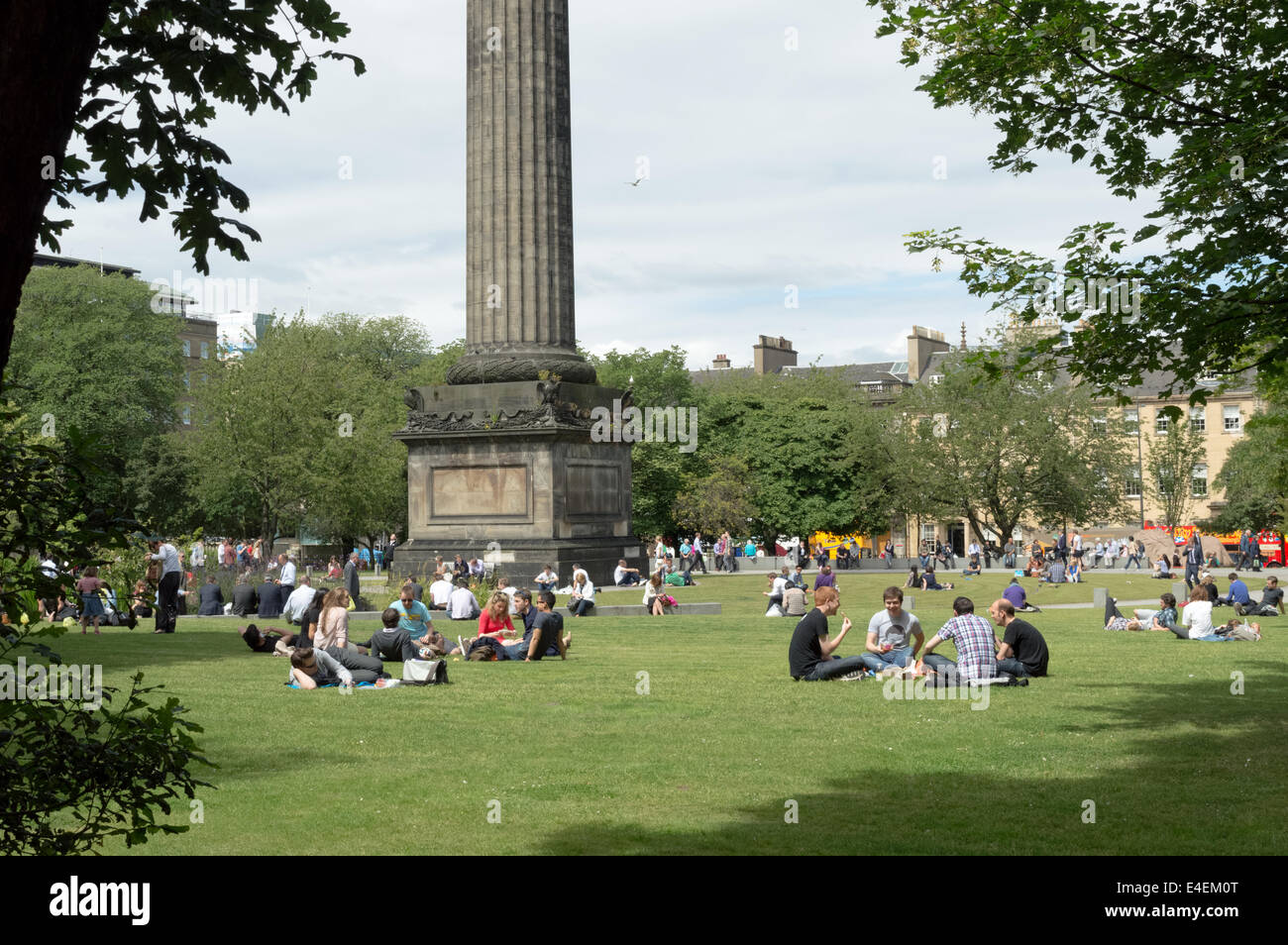 People enjoying the summer weather in St Andrews Square, Edinburgh Stock Photo