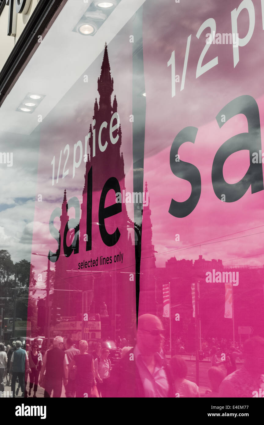 The Scott Monument reflected in a shop window on Princes Street, Edinburgh Stock Photo
