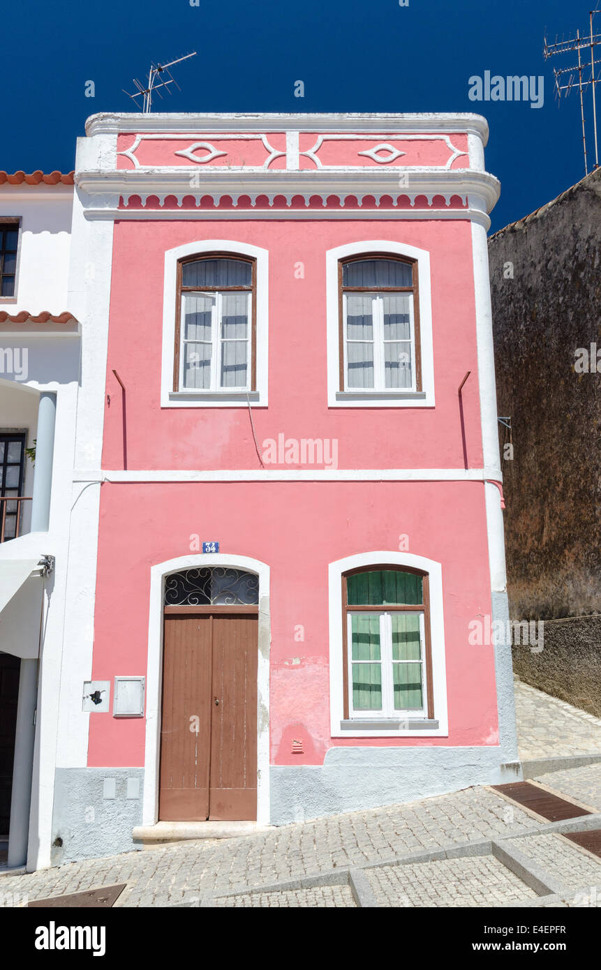A distinctive house painted bright pink in the pretty town of Monchique in the Serra de Monchique, Portugal Stock Photo