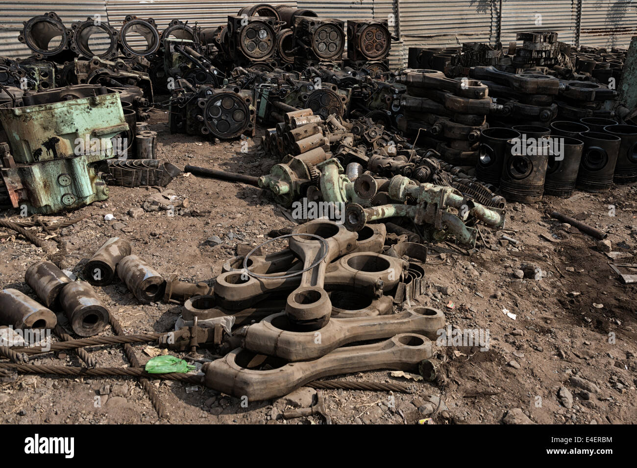 Scrapped ship engine parts in Alang ship breaking yard, India. Stock Photo