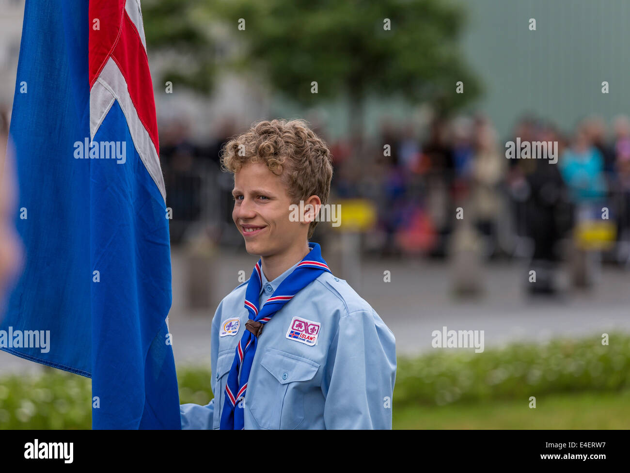 Portrait of Icelandic Boy Scout holding a flag during a parade for Independence day, June 17. Reykjavik, Iceland Stock Photo