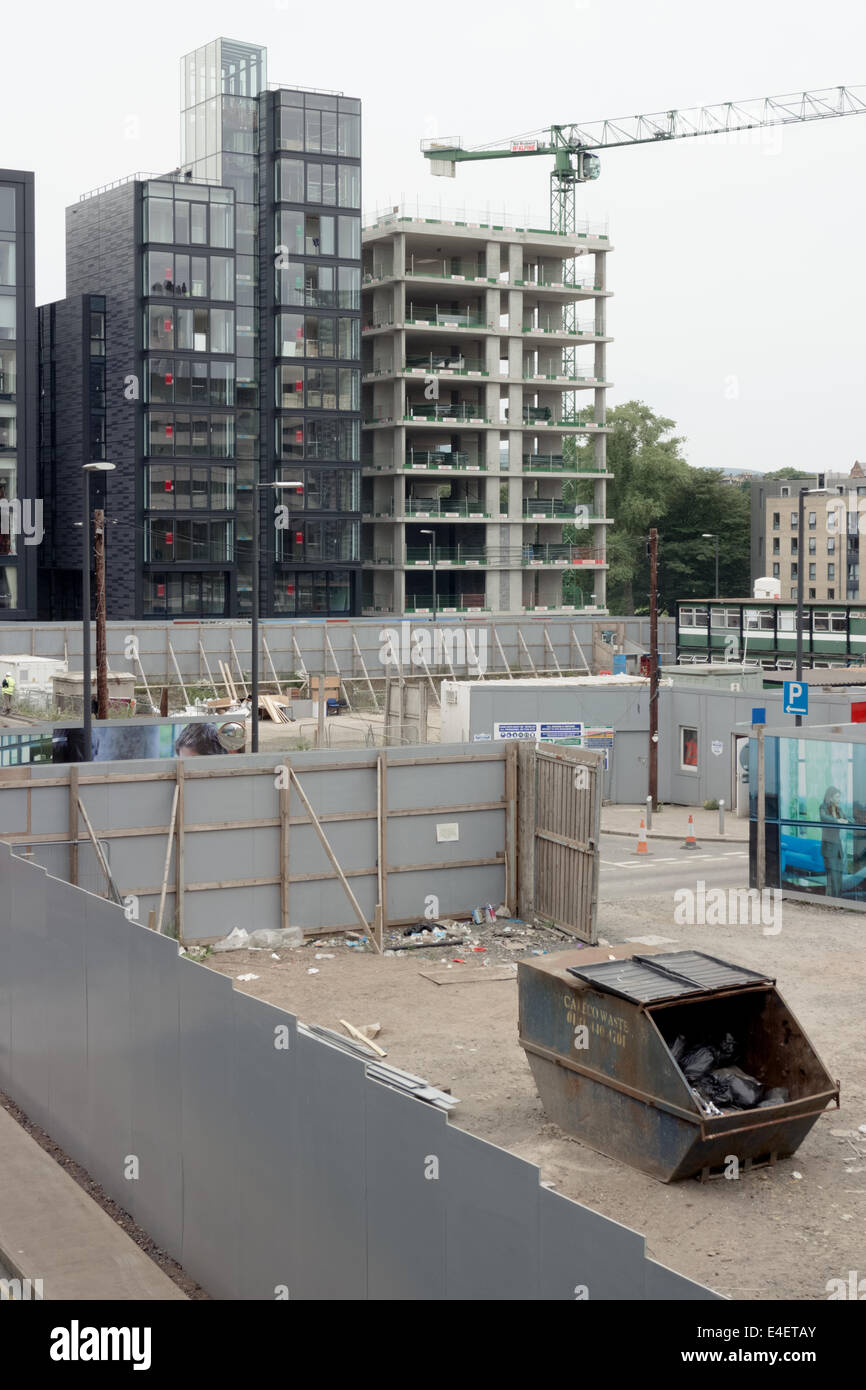 Contractors vans and cars parked on a construction site in Edinburgh's Quartermile Stock Photo