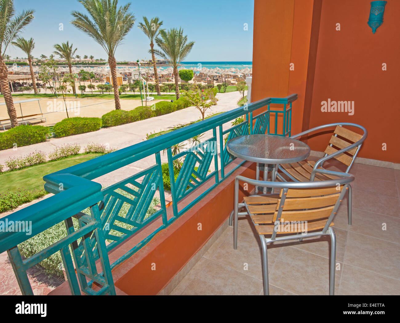 Chairs and table on tropical luxury hotel balcony with view Stock Photo