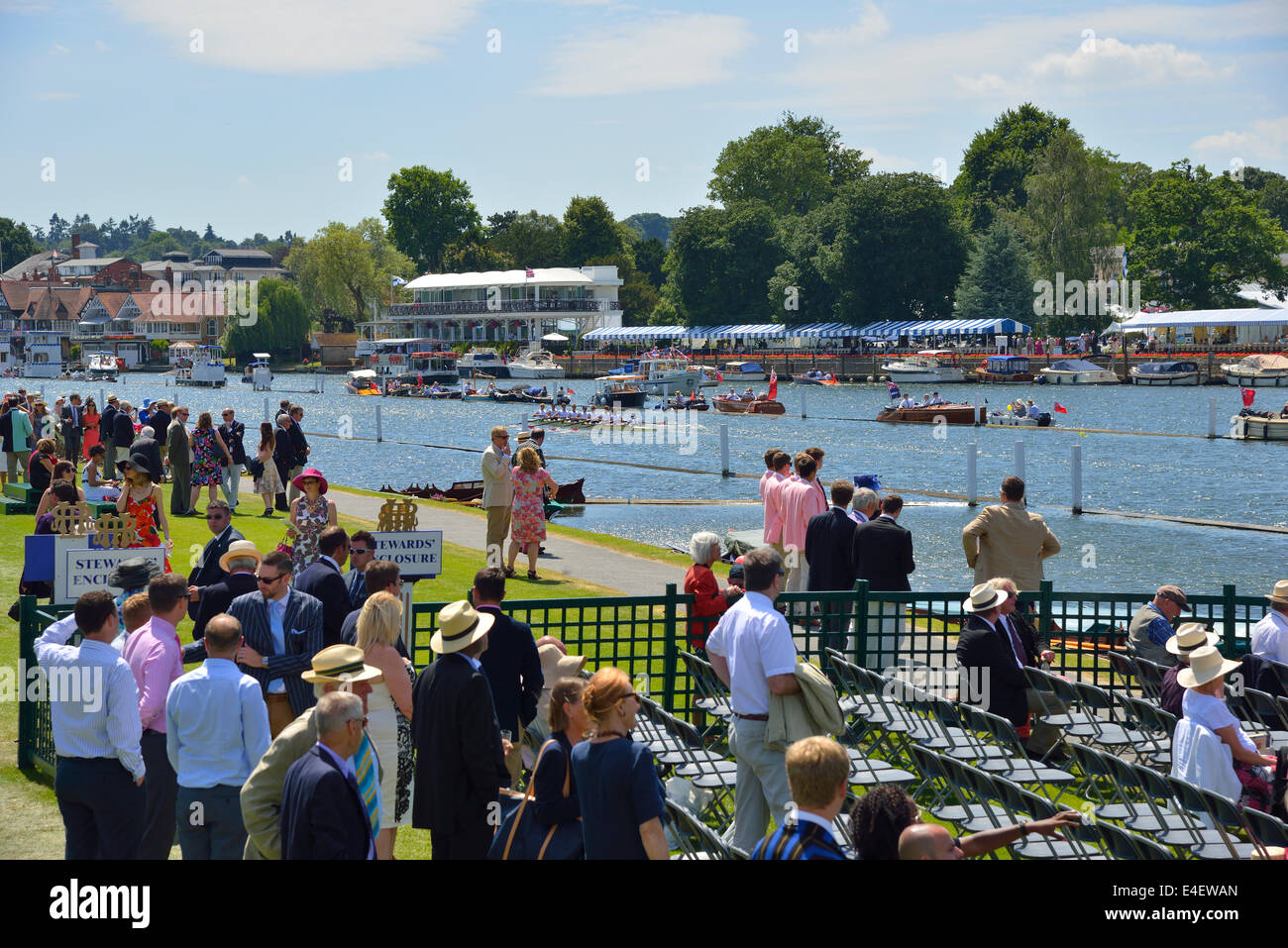 View into the Stewards Enclosure of the crowds attending the rowing regatta at the Henley Royal Regatta, Henley on Thames, Oxfordshire, England,UK Stock Photo