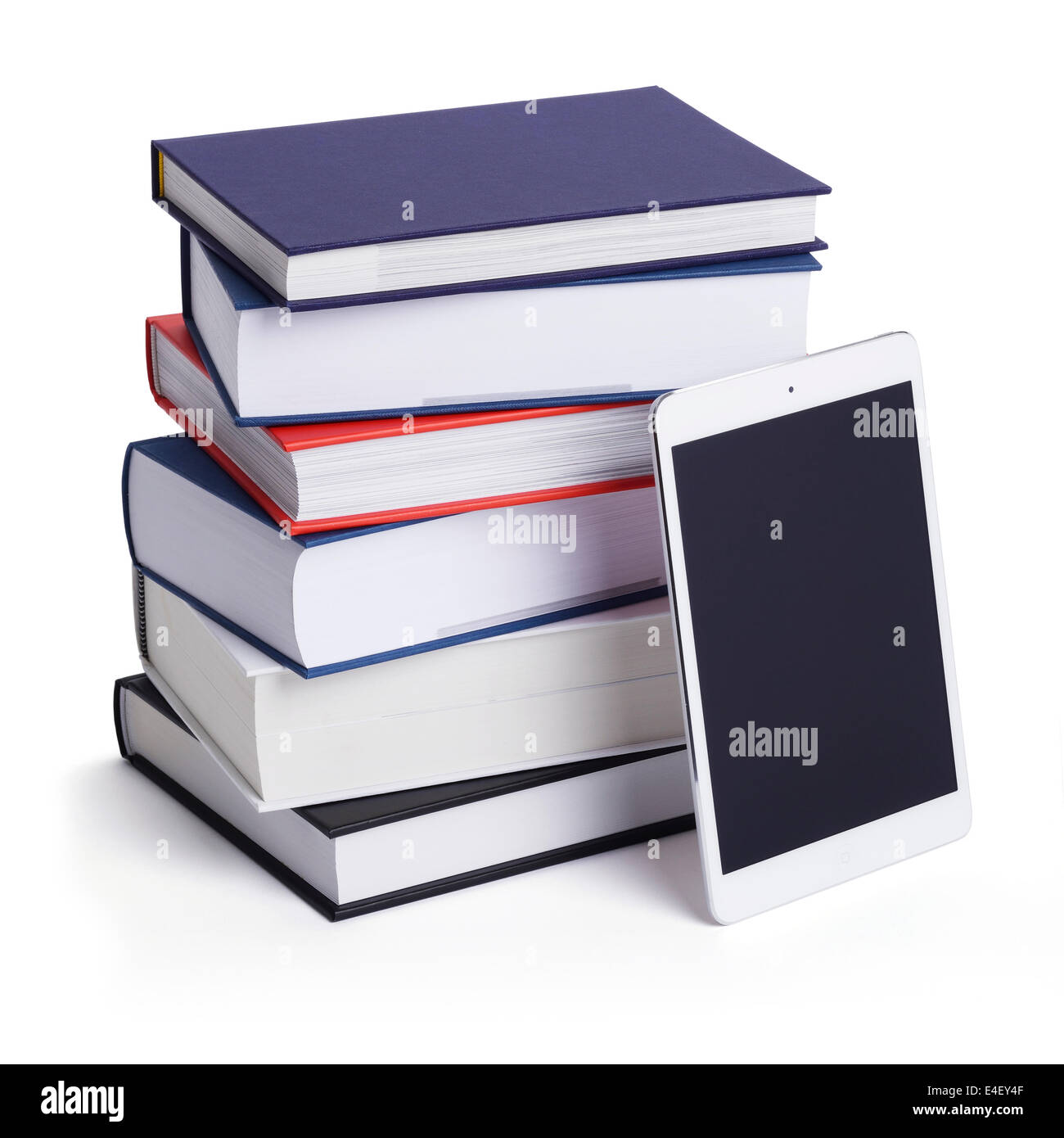 Stack of hardback books with an iPad tablet Stock Photo