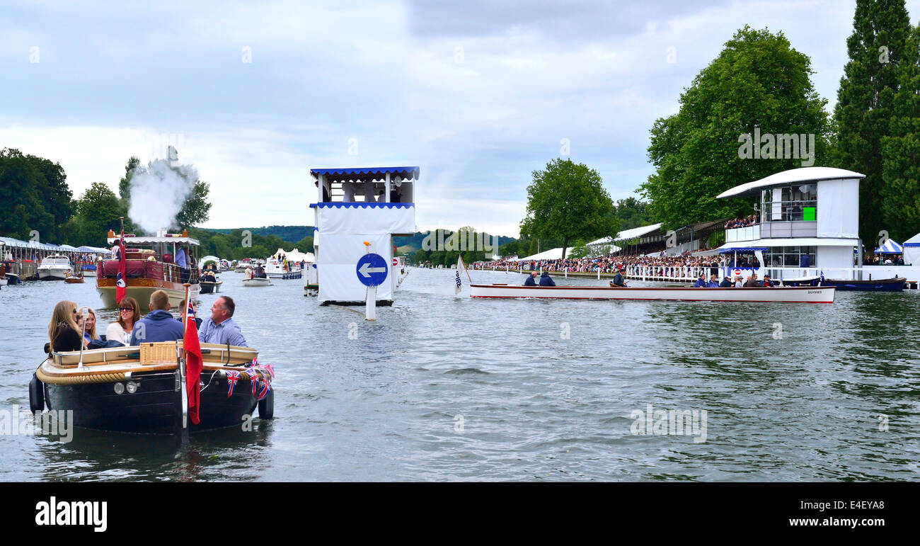 Umpire's  launch  at the finish post going  to the dock  to change over inbetween races at the 175 th Henley Royal Regatta . Stock Photo