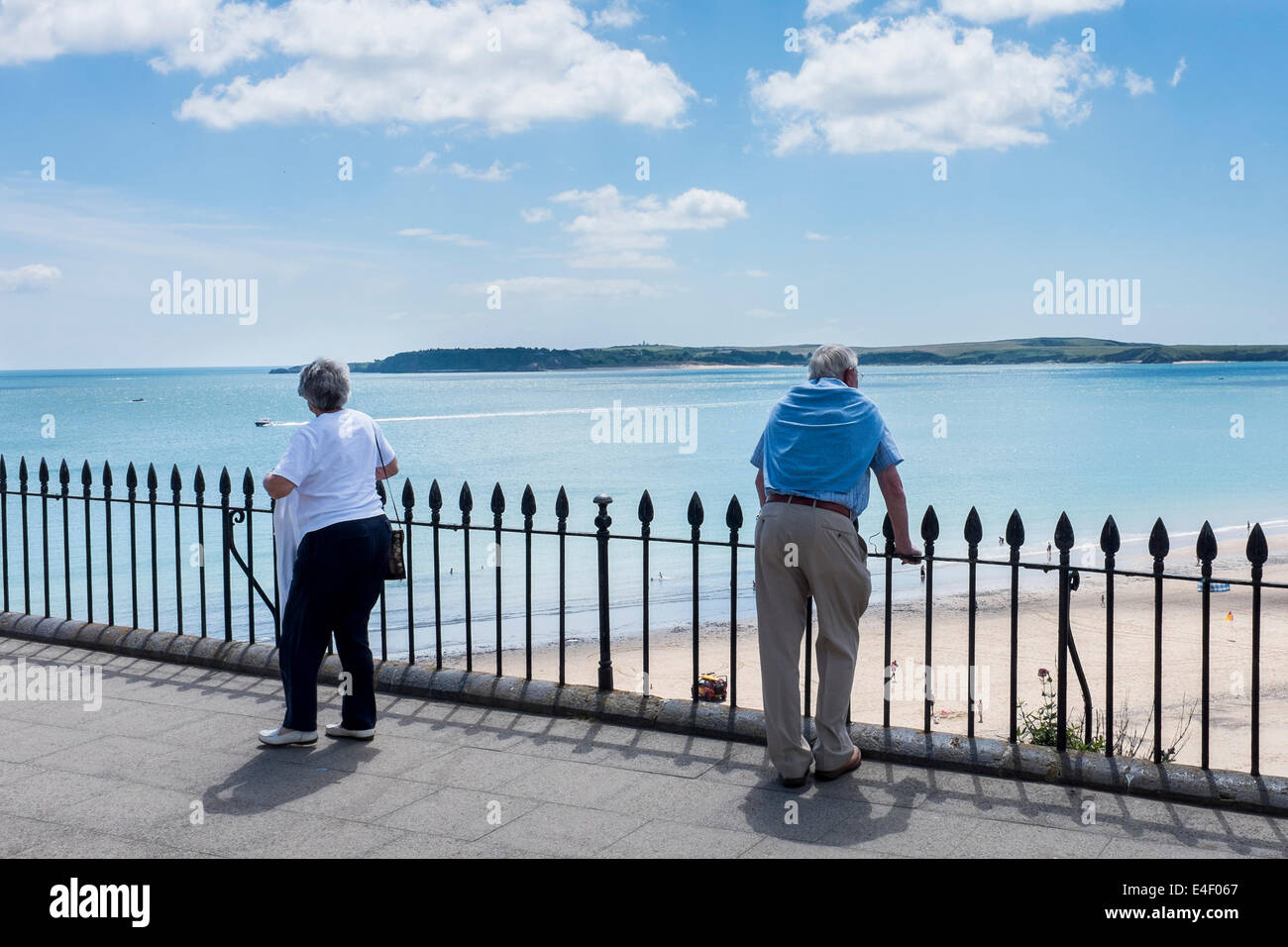 Man looking out to a beach and the sea Stock Photo - Alamy