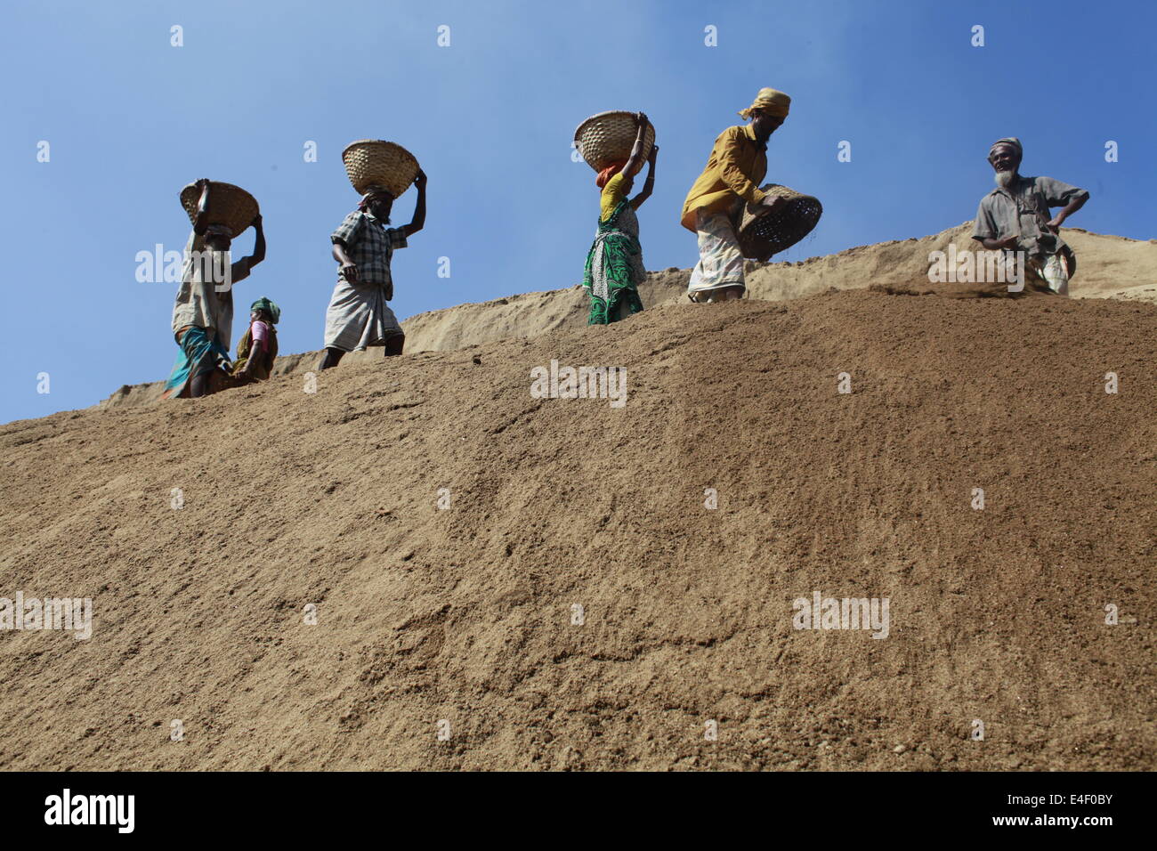 labor in Bangladesh,Asia,Asian,Ethnicity,Bangladesh,Bangladeshi,Basket,Bengali,Boat,Color,Image,Deficiency,Deprivation,Deprive,D Stock Photo