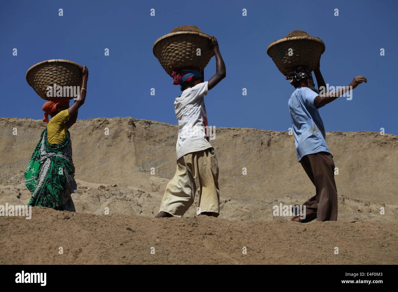 labor in Bangladesh,Asia,Asian,Ethnicity,Bangladesh,Bangladeshi,Basket,Bengali,Boat,Color,Image,Deficiency,Deprivation,Deprive, Stock Photo