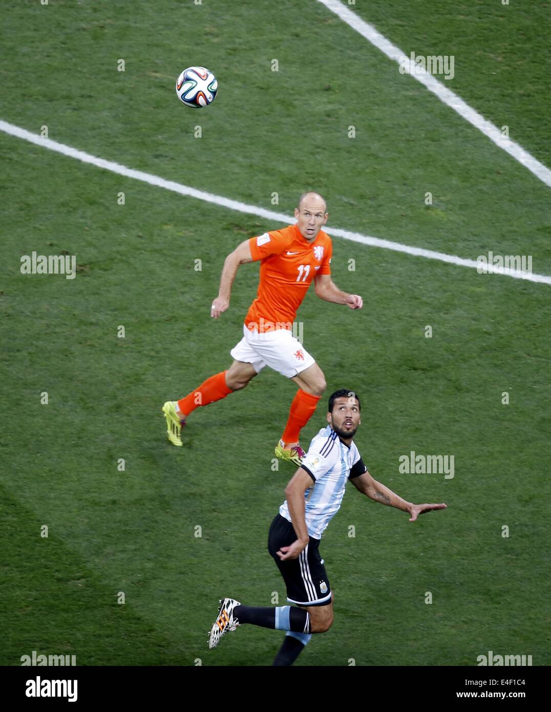 Sao Paulo, Brazil. 9th July, 2014. Netherlands' Arjen Robben vies with Argentina's Ezequiel Garay during a semifinal match between Netherlands and Argentina of 2014 FIFA World Cup at the Arena de Sao Paulo Stadium in Sao Paulo, Brazil, on July 9, 2014. Credit:  Liao Yujie/Xinhua/Alamy Live News Stock Photo