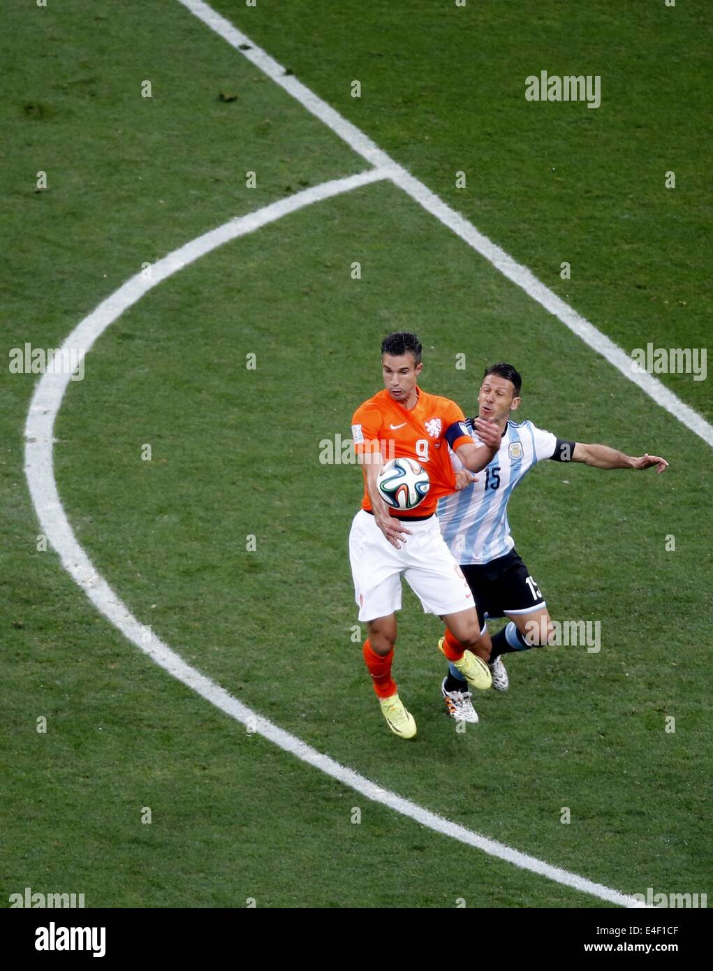 Sao Paulo, Brazil. 9th July, 2014. Netherlands' Robin van Persie vies with Argentina's Martin Demichelis during a semifinal match between Netherlands and Argentina of 2014 FIFA World Cup at the Arena de Sao Paulo Stadium in Sao Paulo, Brazil, on July 9, 2014. Credit:  Liao Yujie/Xinhua/Alamy Live News Stock Photo