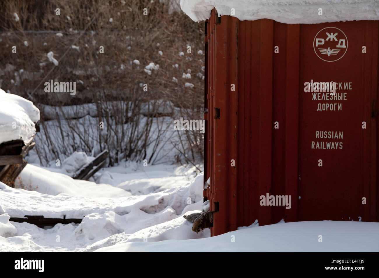 Metal Russian shipping container snow covered sign Stock Photo
