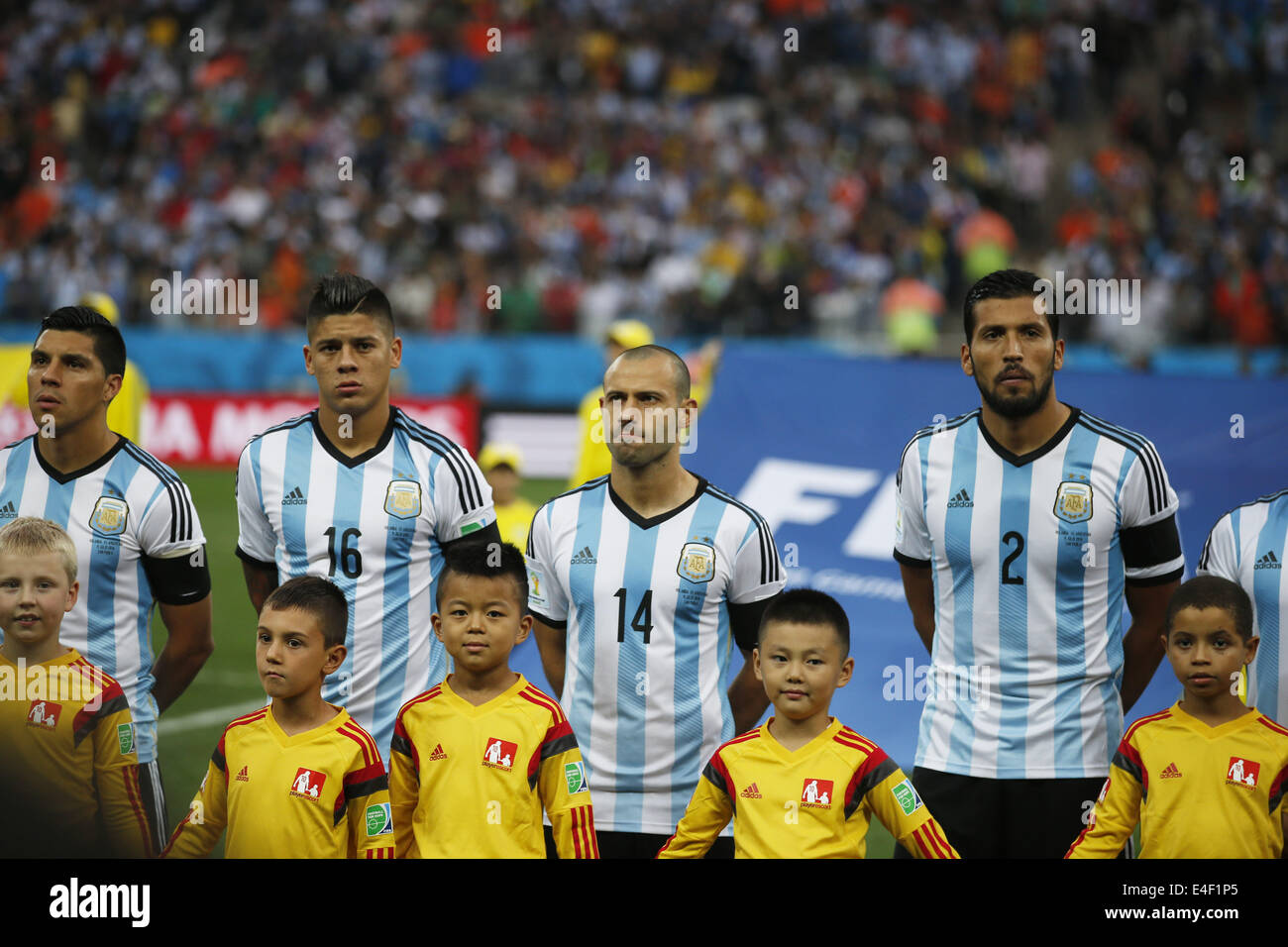 Sao Paulo, Brazil. 9th July, 2014. Argentina's Enzo Perez, Marcos Rojo, Javier Mascherano and Ezequiel Garay (from L to R, back) are seen in a moment of silence dedicated to Alfredo Di Stefano, Argentinian football player who passed away on July 7, 2014, before a semifinal match between Netherlands and Argentina of 2014 FIFA World Cup at the Arena de Sao Paulo Stadium in Sao Paulo, Brazil, on July 9, 2014. Credit:  Wang Lili/Xinhua/Alamy Live News Stock Photo