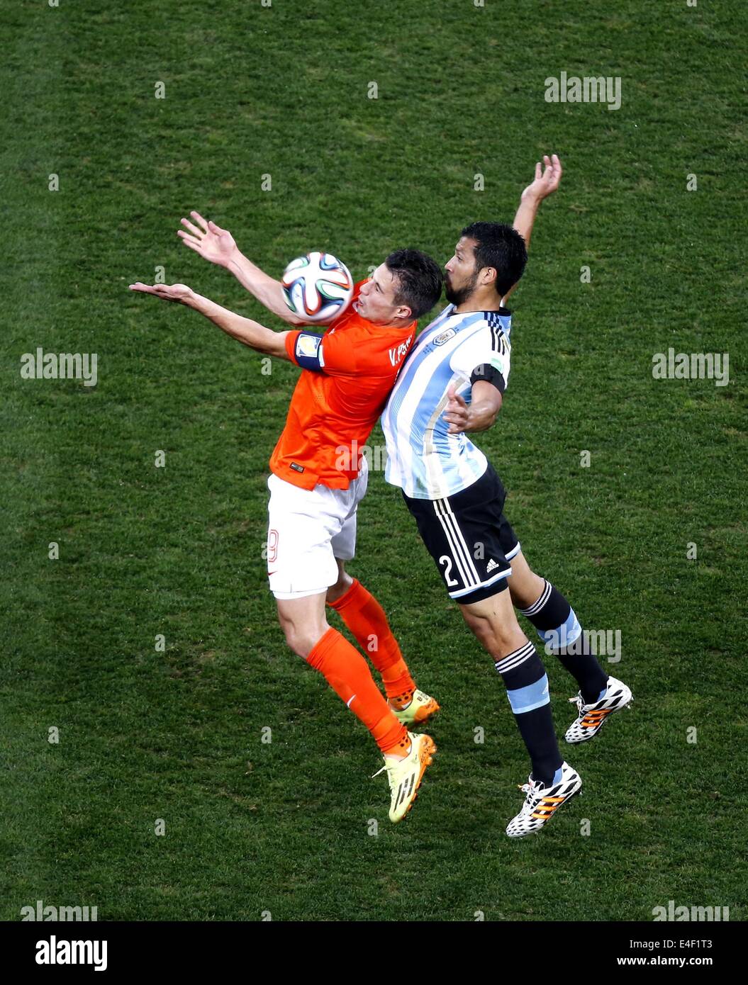 Sao Paulo, Brazil. 9th July, 2014. Netherlands' Robin van Persie vies with Argentina's Ezequiel Garay during a semifinal match between Netherlands and Argentina of 2014 FIFA World Cup at the Arena de Sao Paulo Stadium in Sao Paulo, Brazil, on July 9, 2014. Credit:  Liao Yujie/Xinhua/Alamy Live News Stock Photo