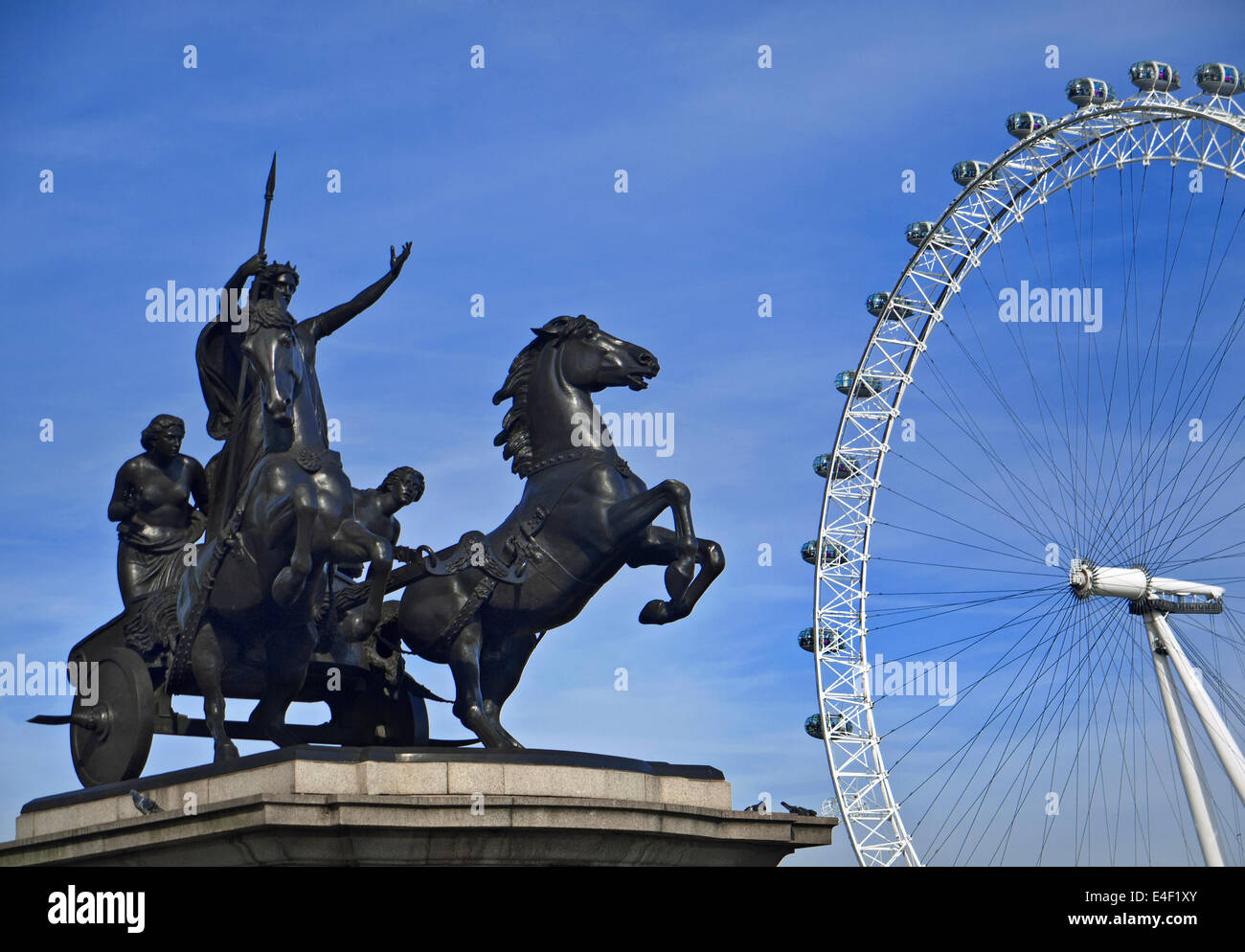 Statue of Boudica on horse drawn chariot with London Eye behind Westminster Bridge London UK Stock Photo