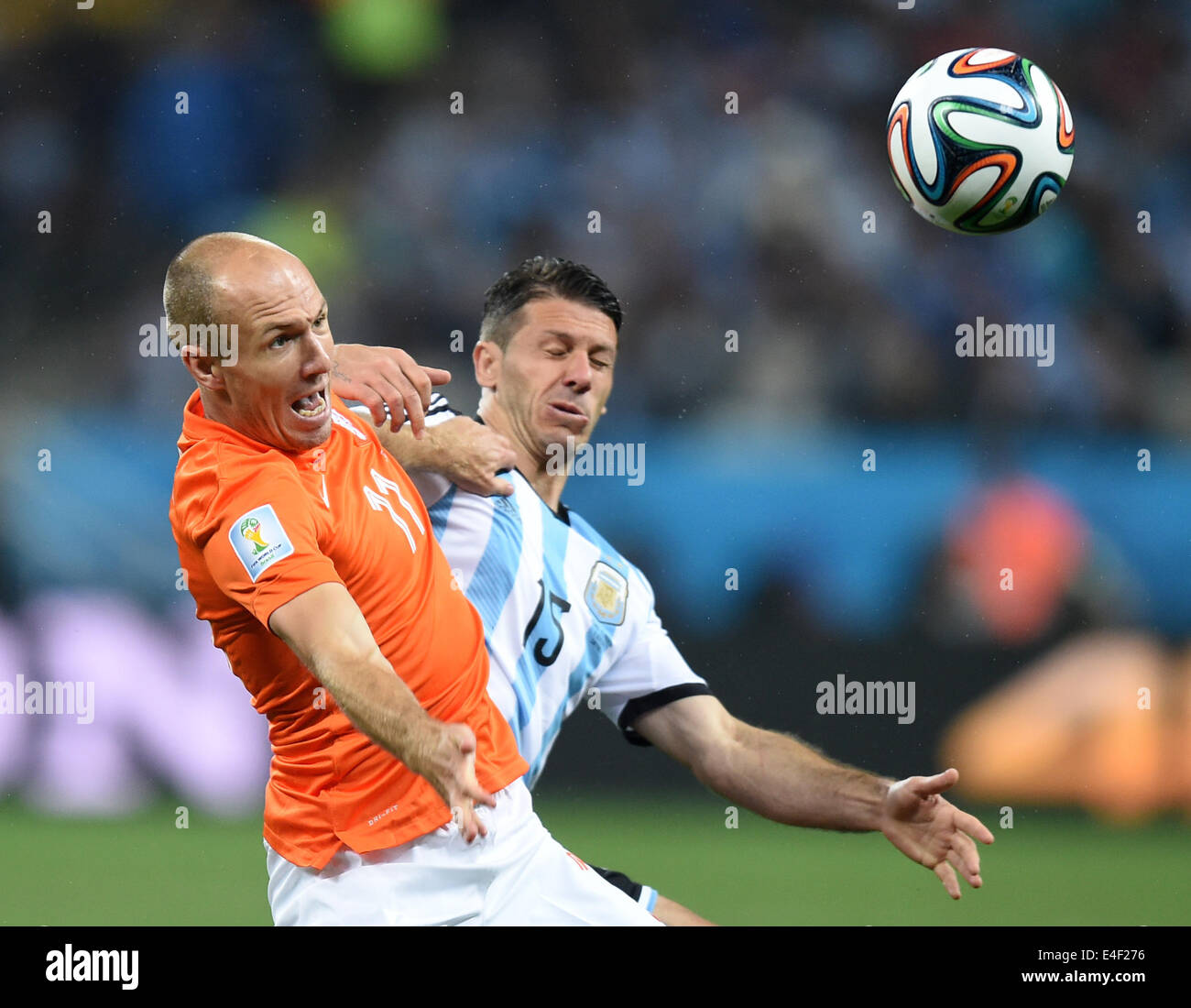 Sao Paulo, Brazil. 09th July, 2014. Martin Demichelis (R) of Argentina and Arjen Robben of the Netherlands vie for the ball during the FIFA World Cup 2014 semi-final soccer match between the Netherlands and Argentina at the Arena Corinthians in Sao Paulo, Brazil, 09 July 2014. Photo: Marius Becker/dpa/Alamy Live News Stock Photo