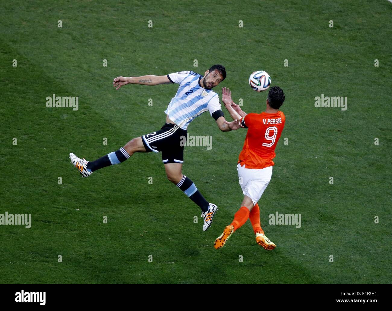 Sao Paulo, Brazil. 9th July, 2014. Netherlands' Robin van Persie vies with Argentina's Ezequiel Garay during a semifinal match between Netherlands and Argentina of 2014 FIFA World Cup at the Arena de Sao Paulo Stadium in Sao Paulo, Brazil, on July 9, 2014. Credit:  Liao Yujie/Xinhua/Alamy Live News Stock Photo