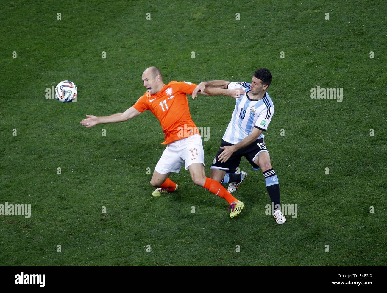 Sao Paulo, Brazil. 9th July, 2014. Netherlands' Arjen Robben vies with Argentina's Martin Demichelis during a semifinal match between Netherlands and Argentina of 2014 FIFA World Cup at the Arena de Sao Paulo Stadium in Sao Paulo, Brazil, on July 9, 2014. Credit:  Liao Yujie/Xinhua/Alamy Live News Stock Photo