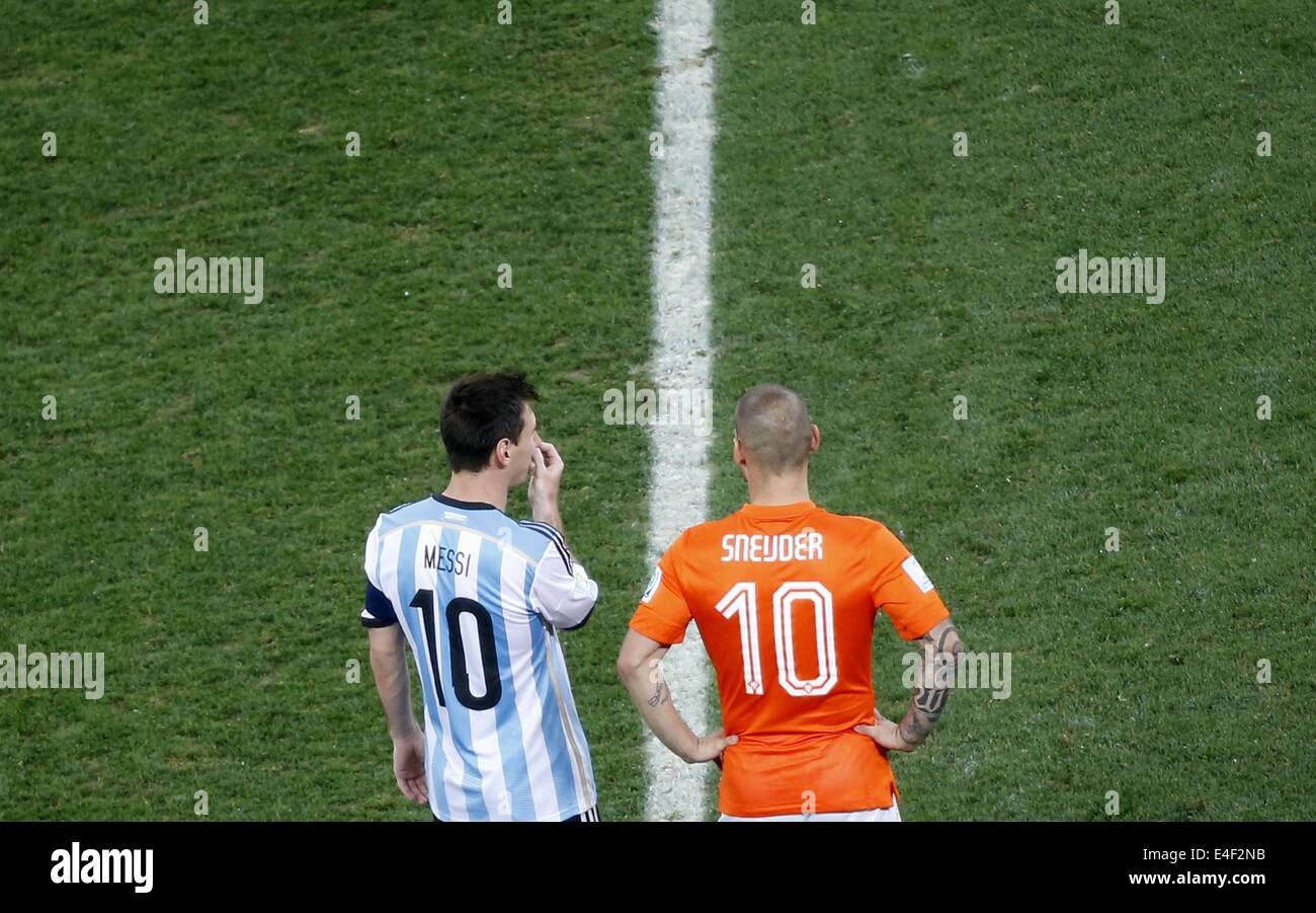 Sao Paulo, Brazil. 9th July, 2014. Netherlands' Wesley Sneijder and Argentina's Lionel Messi react during a semifinal match between Netherlands and Argentina of 2014 FIFA World Cup at the Arena de Sao Paulo Stadium in Sao Paulo, Brazil, on July 9, 2014. Credit:  Liao Yujie/Xinhua/Alamy Live News Stock Photo