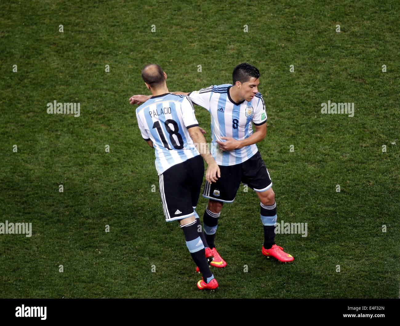 Sao Paulo, Brazil. 9th July, 2014. Argentina's Enzo Perez (R) is substituted by Rodrigo Palacio during a semifinal match between Netherlands and Argentina of 2014 FIFA World Cup at the Arena de Sao Paulo Stadium in Sao Paulo, Brazil, on July 9, 2014. Credit:  Liao Yujie/Xinhua/Alamy Live News Stock Photo