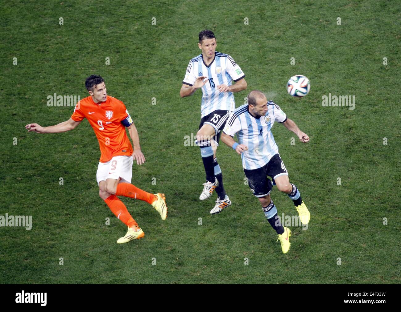 Sao Paulo, Brazil. 9th July, 2014. Netherlands' Robin van Persie (L) vies with Argentina's Martin Demichelis (C) and Pablo Zabaleta (R) during a semifinal match between Netherlands and Argentina of 2014 FIFA World Cup at the Arena de Sao Paulo Stadium in Sao Paulo, Brazil, on July 9, 2014. Credit:  Liao Yujie/Xinhua/Alamy Live News Stock Photo