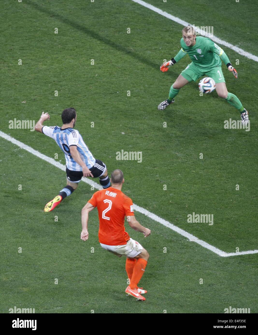 Sao Paulo, Brazil. 9th July, 2014. Netherlands' goalkeeper Jasper Cillessen (R) and Ron Vlaar (C) defend against Argentina's Gonzalo Higuain (L) during a semifinal match between Netherlands and Argentina of 2014 FIFA World Cup at the Arena de Sao Paulo Stadium in Sao Paulo, Brazil, on July 9, 2014. Credit:  Liao Yujie/Xinhua/Alamy Live News Stock Photo
