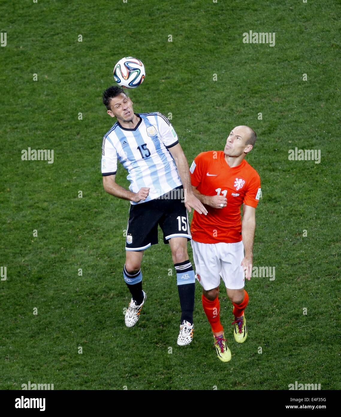 Sao Paulo, Brazil. 9th July, 2014. Netherlands' Arjen Robben competes for a header with Argentina's Martin Demichelis during a semifinal match between Netherlands and Argentina of 2014 FIFA World Cup at the Arena de Sao Paulo Stadium in Sao Paulo, Brazil, on July 9, 2014. Credit:  Liao Yujie/Xinhua/Alamy Live News Stock Photo