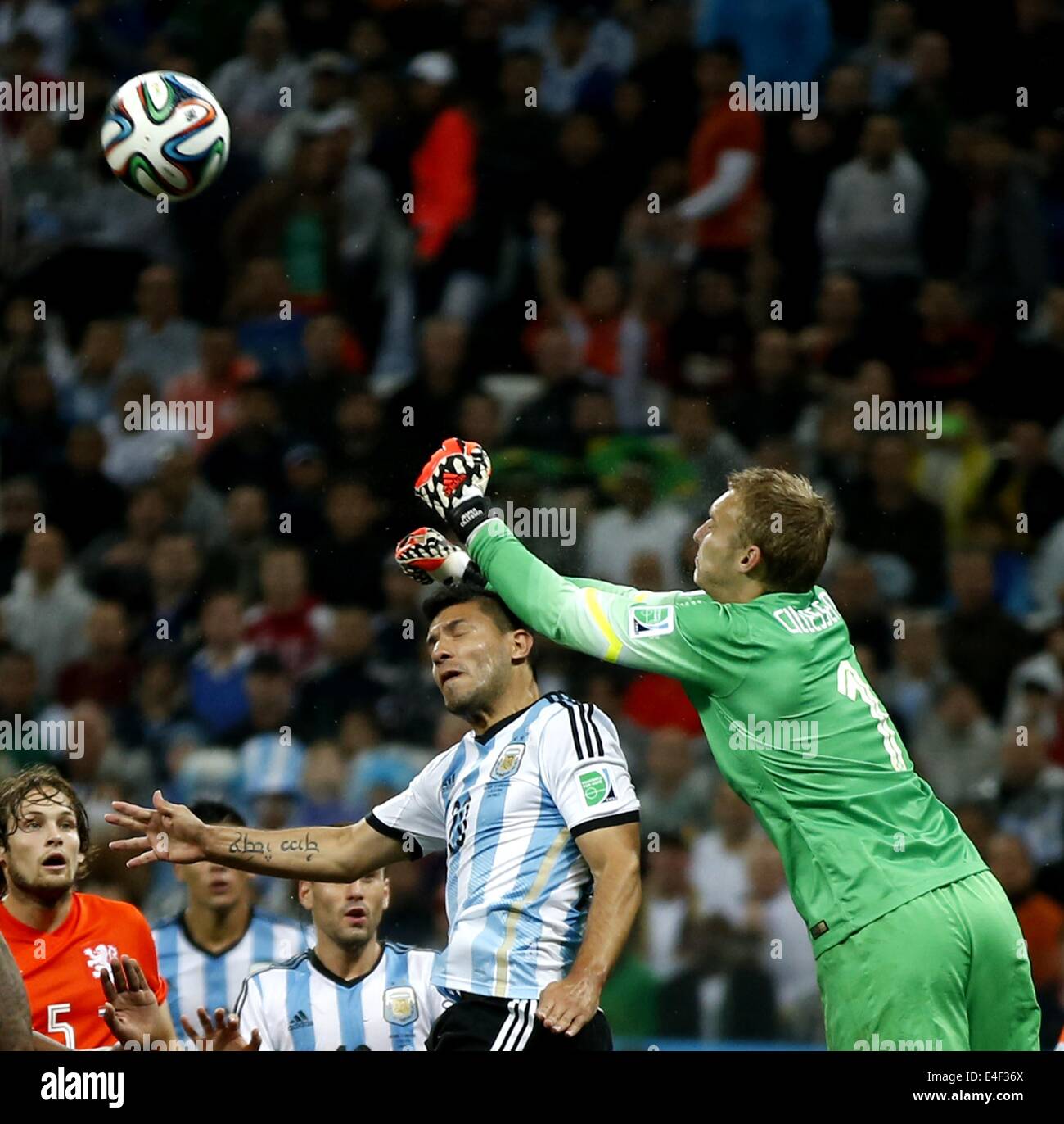 Sao Paulo, Brazil. 9th July, 2014. Netherlands' goalkeeper Jasper Cillessen (R) plucks the ball during a semifinal match between Netherlands and Argentina of 2014 FIFA World Cup at the Arena de Sao Paulo Stadium in Sao Paulo, Brazil, on July 9, 2014. Credit:  Wang Lili/Xinhua/Alamy Live News Stock Photo