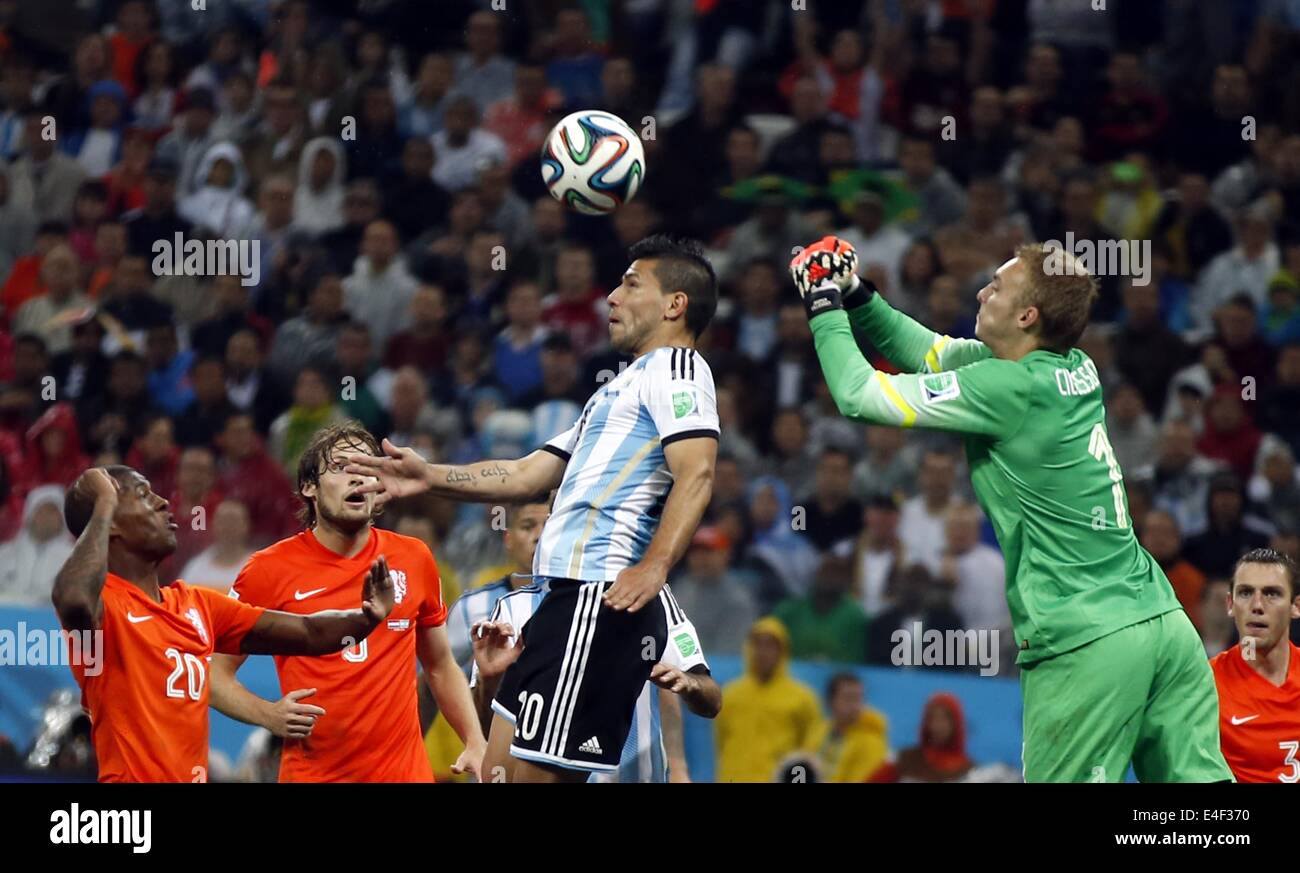 Sao Paulo, Brazil. 9th July, 2014. Netherlands' goalkeeper Jasper Cillessen (2nd R) vies for the ball with Argentina's Sergio Aguero (3rd R) during a semifinal match between Netherlands and Argentina of 2014 FIFA World Cup at the Arena de Sao Paulo Stadium in Sao Paulo, Brazil, on July 9, 2014. Credit:  Wang Lili/Xinhua/Alamy Live News Stock Photo