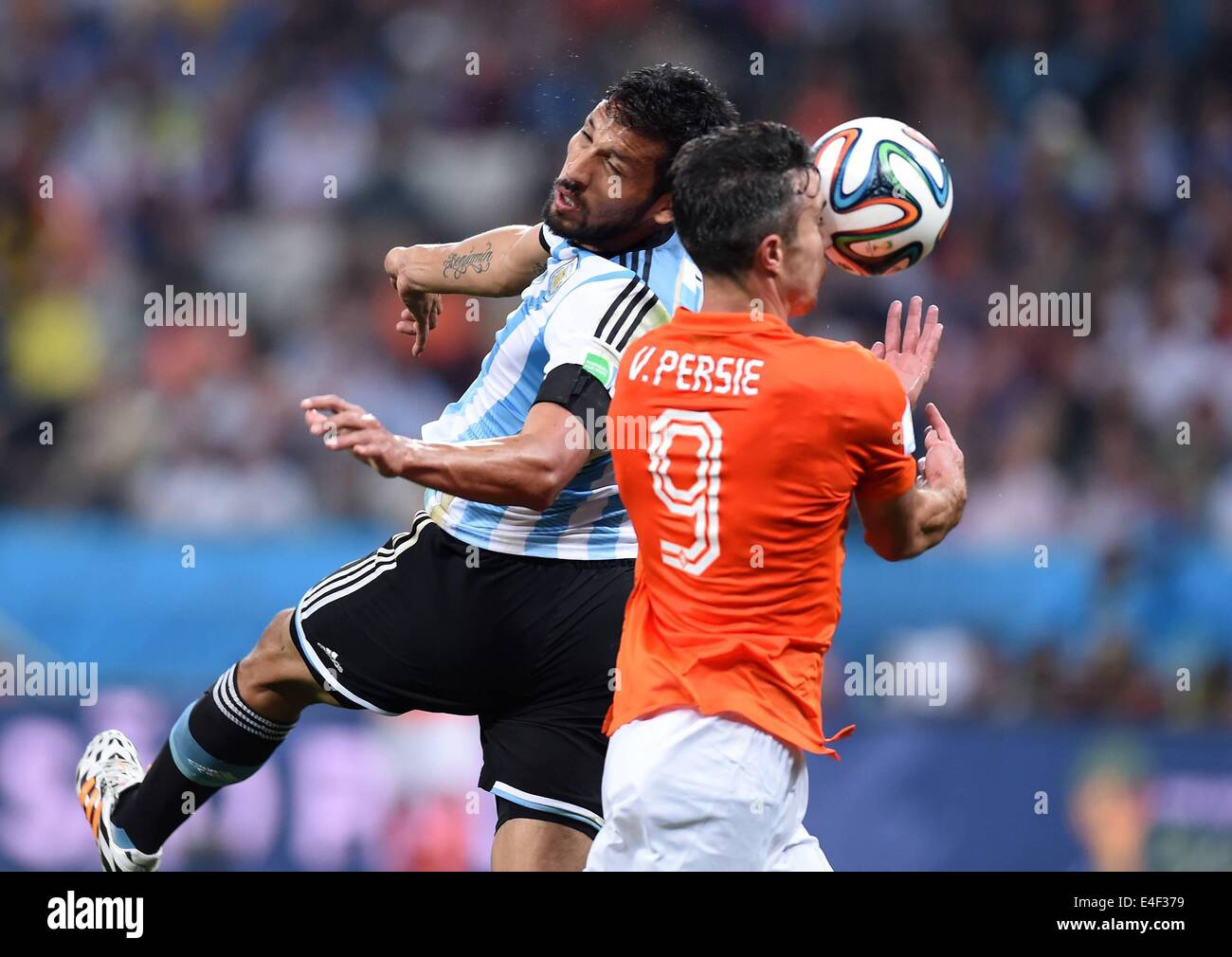 Corinthians Stadium, Sao Paulo, Brazil. 09th July, 2014. FIFA World Cup 2014 semi-final soccer match between the Netherlands and Argentina. Ezequiel Lavezzi (Arg) challenges Robin van Persie (Neth) Credit:  Action Plus Sports/Alamy Live News Stock Photo