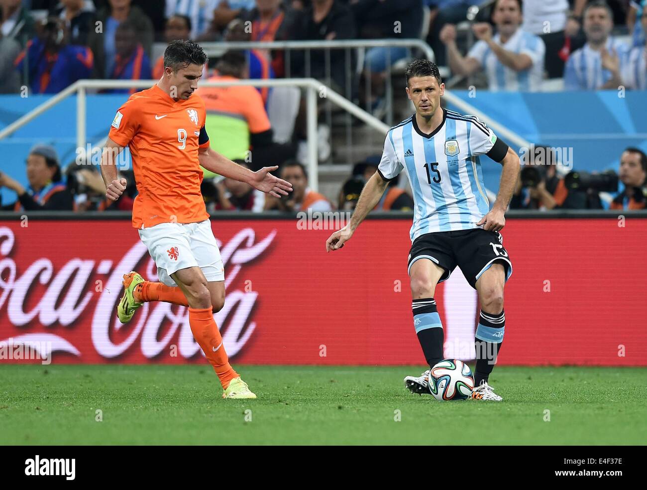 Corinthians Stadium, Sao Paulo, Brazil. 09th July, 2014. FIFA World Cup 2014  semi-final soccer match between the Netherlands and Argentina. Robin van  Persie (li, Neth) challenges Martin Demichelis (re, Arg) Credit: Action, image size:1300x984