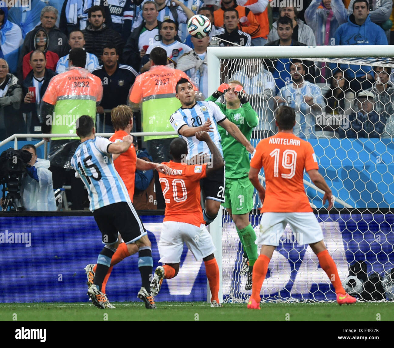 Sao Paulo, Brazil. 09th July, 2014. Sergio Aguero (top) of Argentina and goalkeeper Jasper Cillessen (2-R) of the Netherlands vie for the ball during the FIFA World Cup 2014 semi-final soccer match between the Netherlands and Argentina at the Arena Corinthians in Sao Paulo, Brazil, 09 July 2014. Photo: Marius Becker/dpa/Alamy Live News Stock Photo